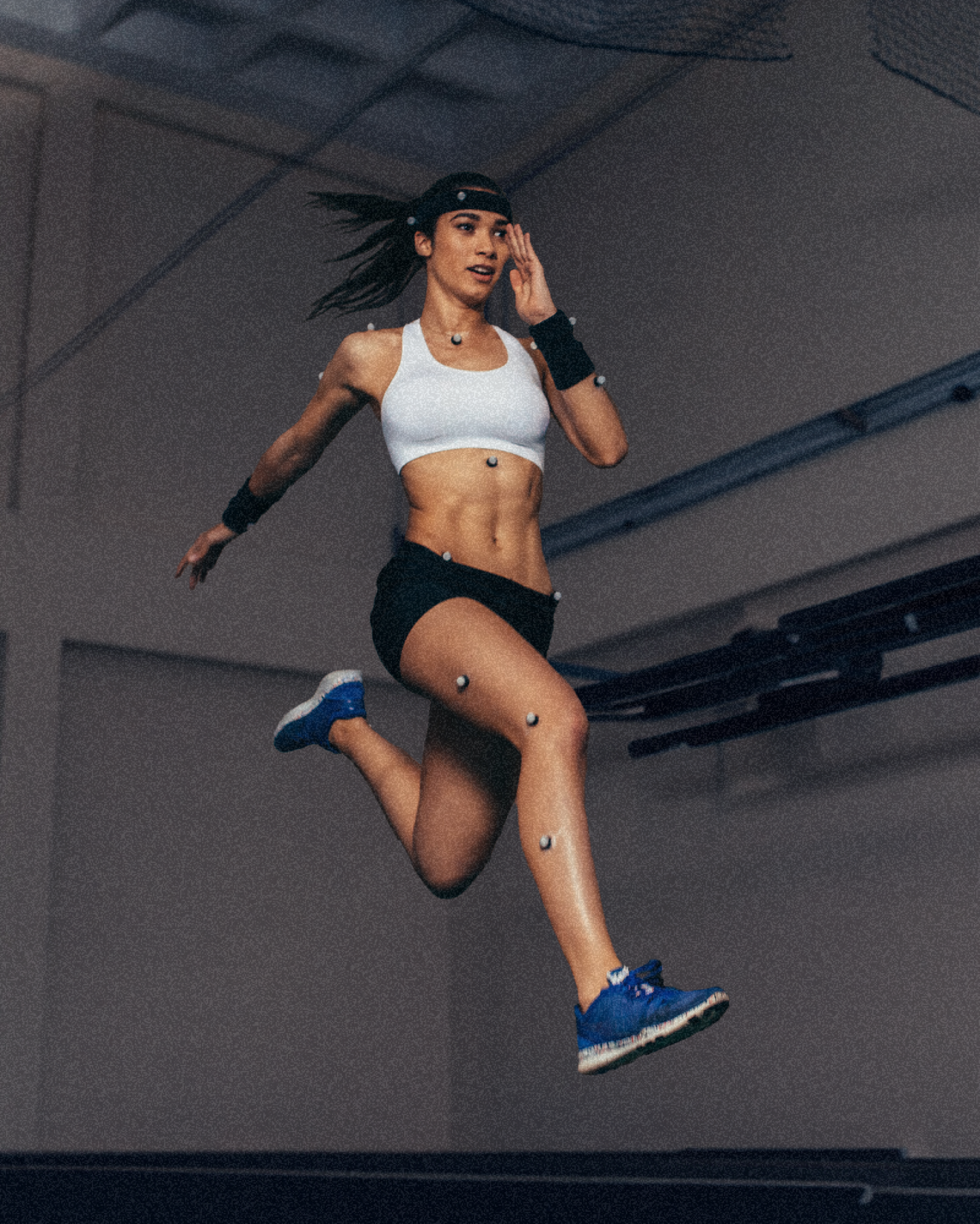 woman running mid-action getting performance tested